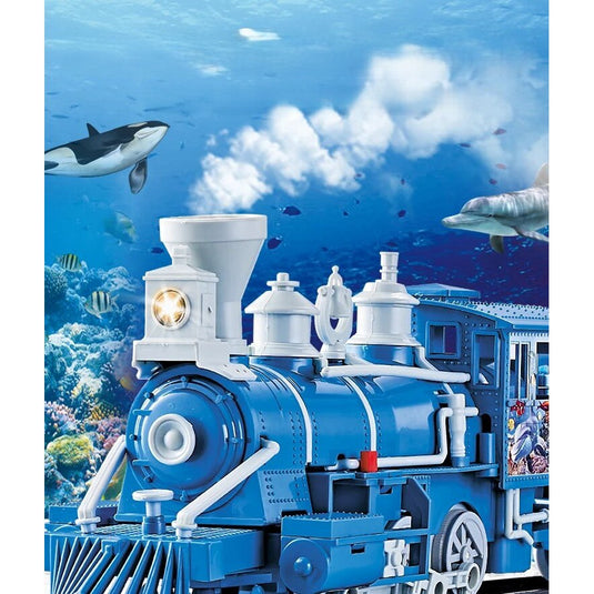 Trenulet Electric cu Aburi OceanExpress pentru Copii, Include Tren Electric cu Efecte Sonore, Lumini, Fum Real, 3 Vagoane, 16 Sine, Model Animalute Marine, Indiggo@, Blue Ocean, +3 Ani