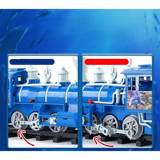 Trenulet Electric cu Aburi OceanExpress pentru Copii, Include Tren Electric cu Efecte Sonore, Lumini, Fum Real, 3 Vagoane, 16 Sine, Model Animalute Marine, Indiggo@, Blue Ocean, +3 Ani