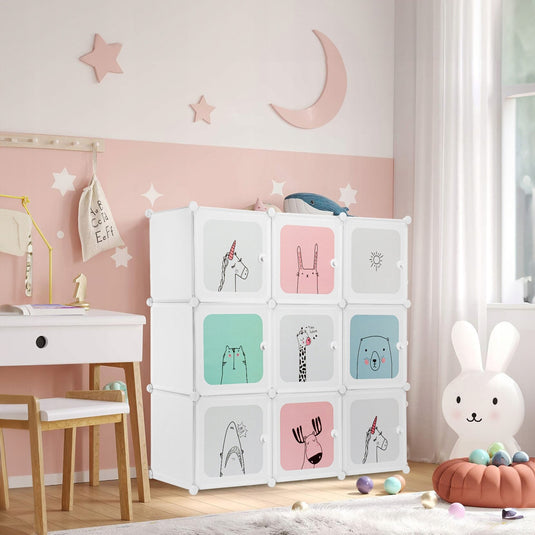 Dulap Modular Copii DreamZoo Indiggo®, Organizator Jucarii si Haine, 9 Compartimente cu Usi, Raft pentru Camera Copilului, Biblioteca Modulara, Greutate Maxima Suportata Aproximativ 5 kg / Compartiment, Dimensiuni - 110x110x37 cm, 3 Ani+, Alb Pastel